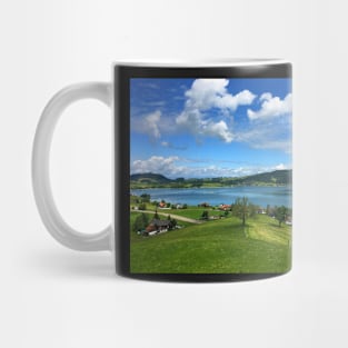 View on a lake and village in Switzerland Mug